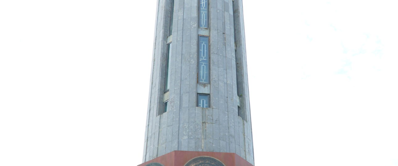Traveler at Lung Cu Flag Tower on the Ha Giang Loop