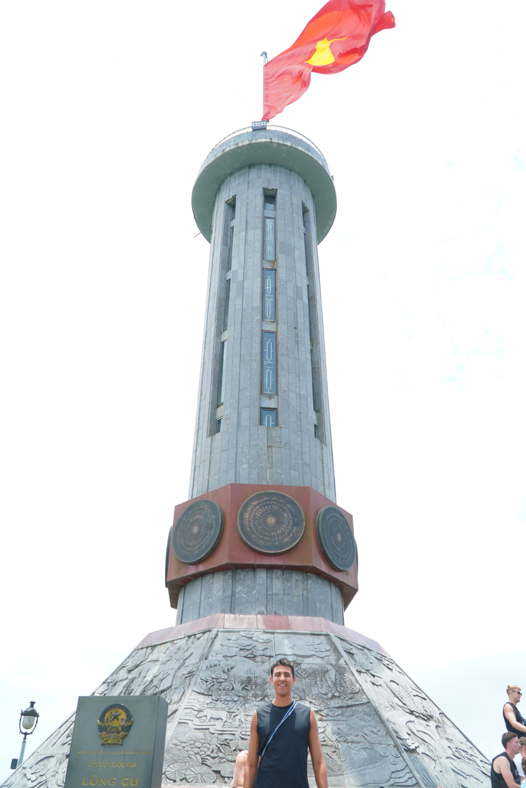 Traveler at Lung Cu Flag Tower on the Ha Giang Loop